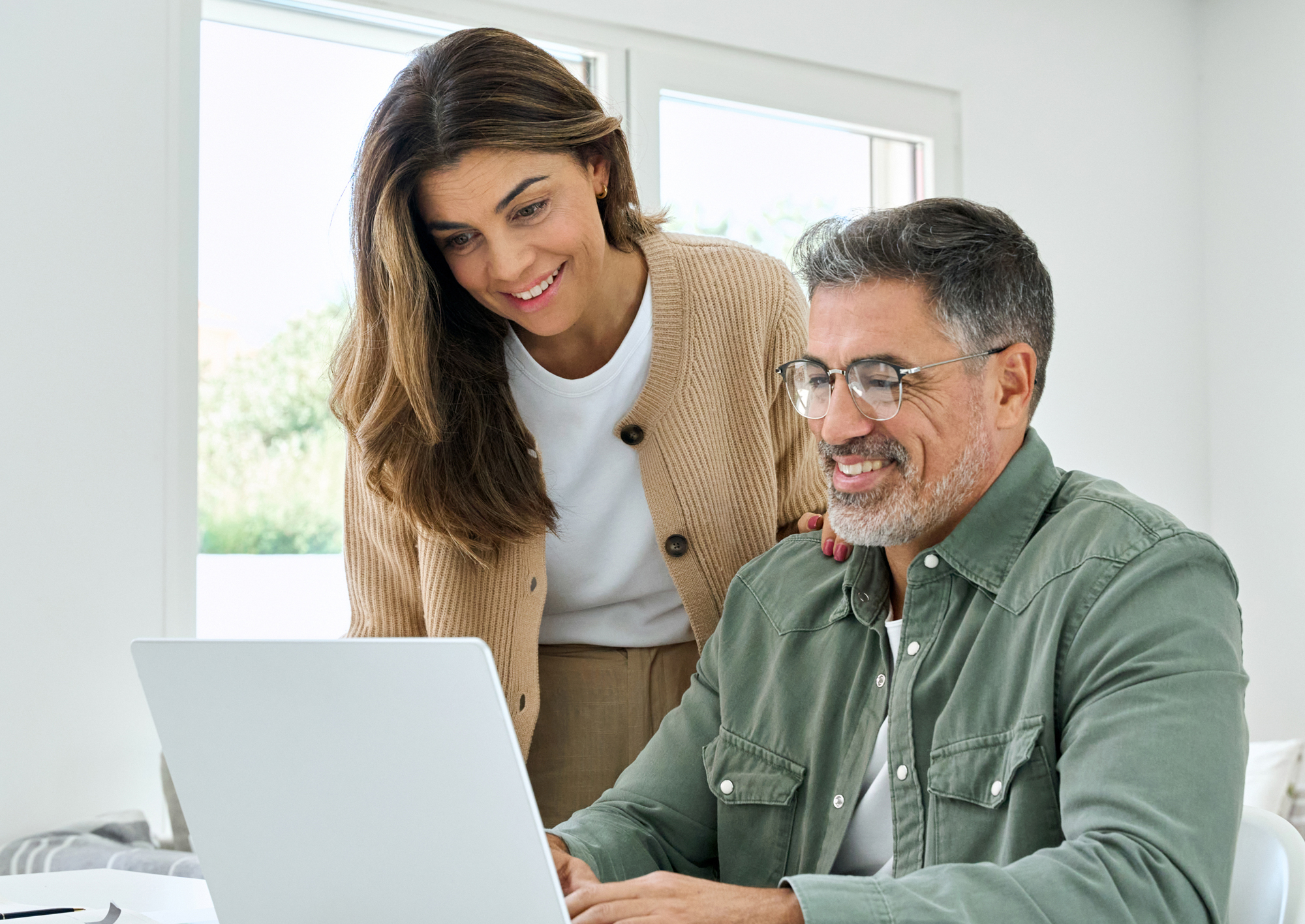 Couple reviewing their tax filing on a laptop